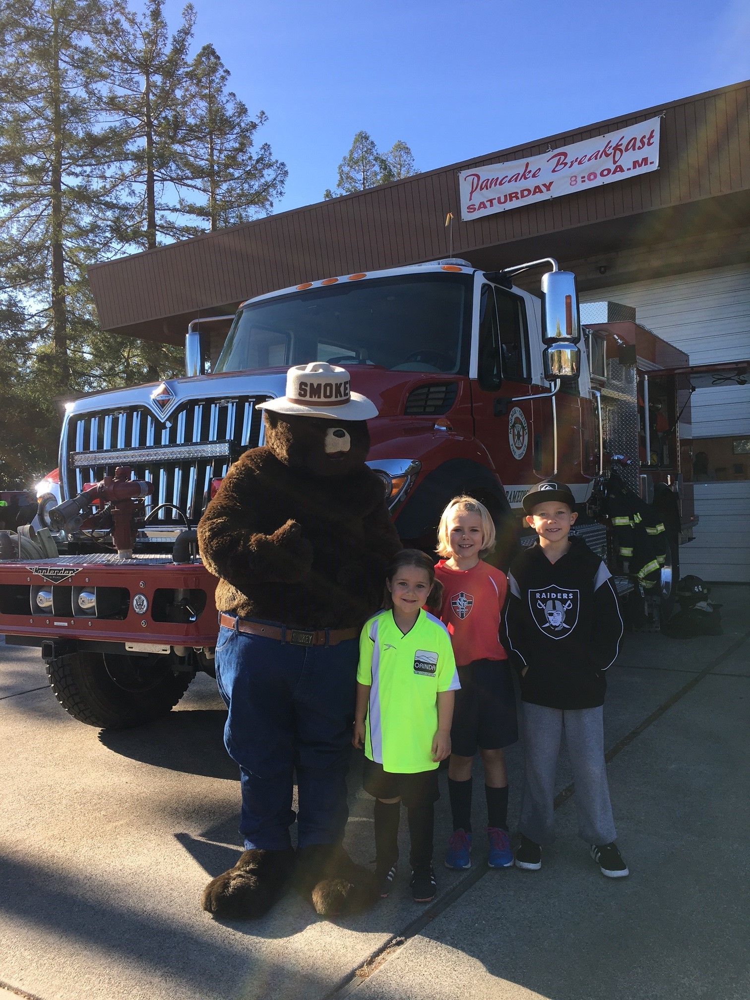 Children with Smoky the Bear character